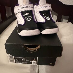 Jordan Kids Black and White Sneakers with Purple Trim
